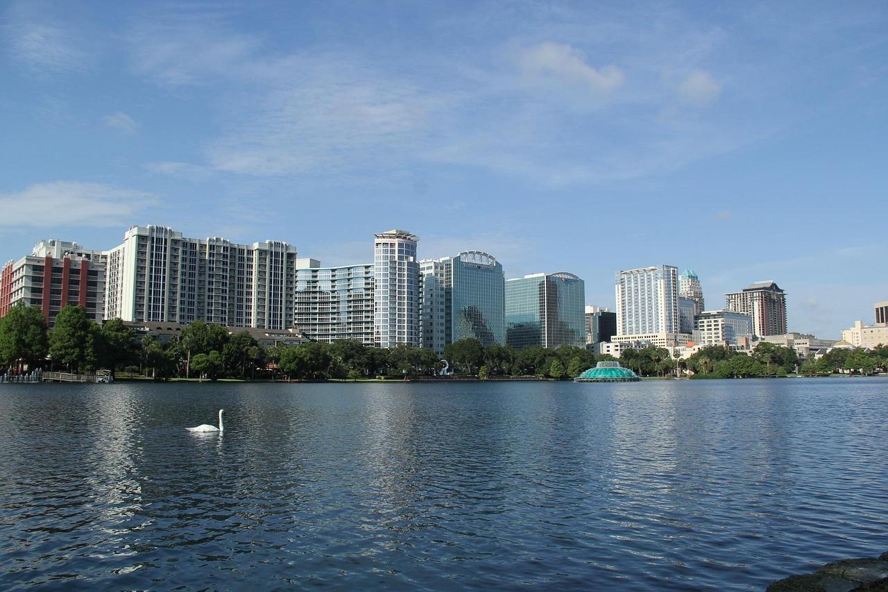 Orlando Florida Eola Lake swan park city skyline water reflection view