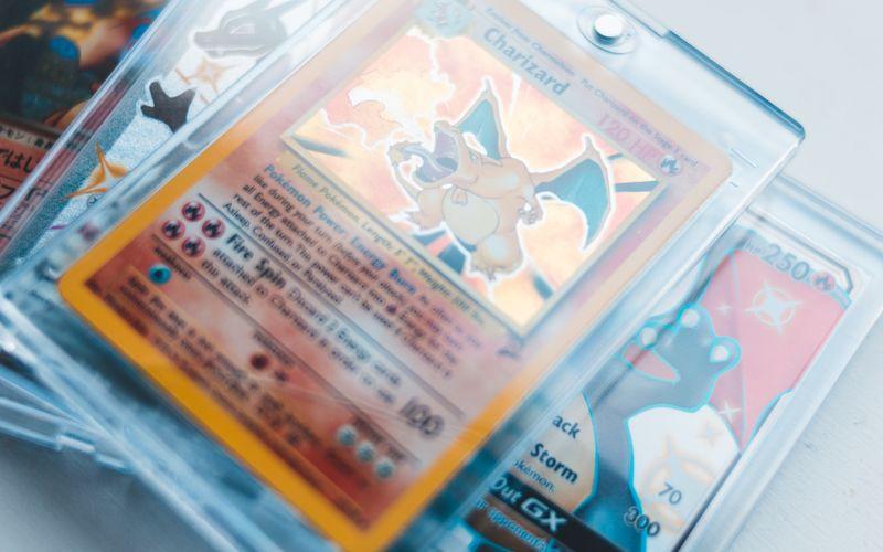 collectible trading cards stored in protective cases on a table